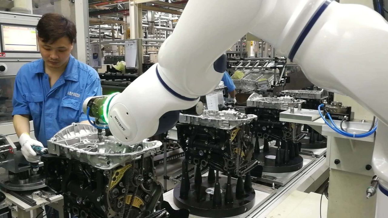 Humanos y robots comparten espacio de trabajo - SIASUN
